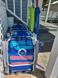 dd7ac31c-b0e9-424c-b404-a6b034201210 6 chairs 3 umbrellas and beach cart
